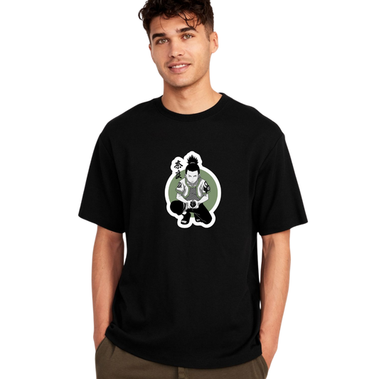 Man wearing black Shikamaru T-shirt with anime character graphic in green circle