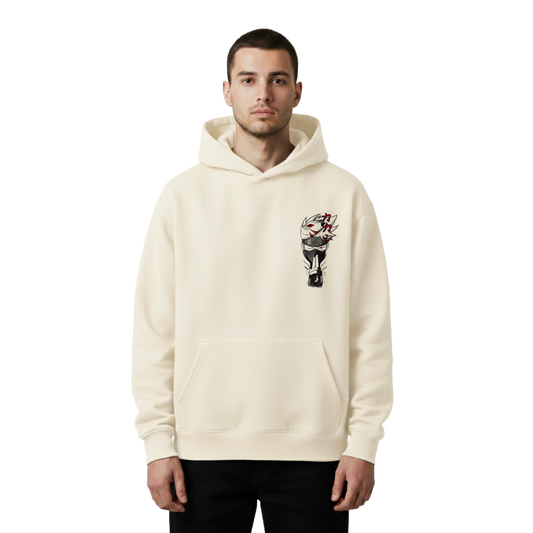 Man wearing a cream hoodie with a graphic design of kakashi on a white background