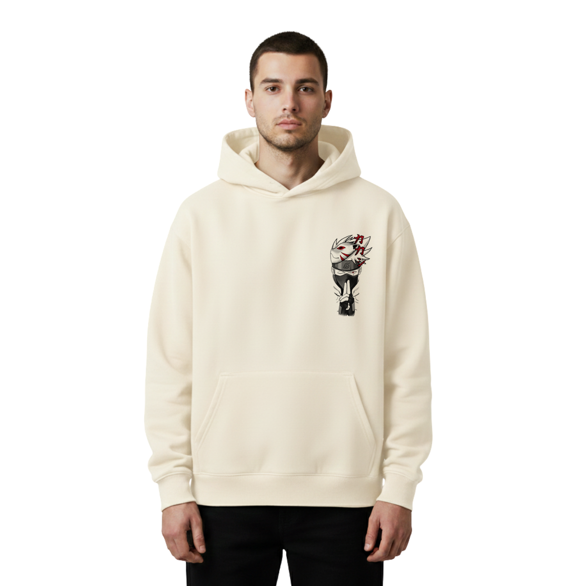Man wearing a cream hoodie with a graphic design of kakashi on a white background