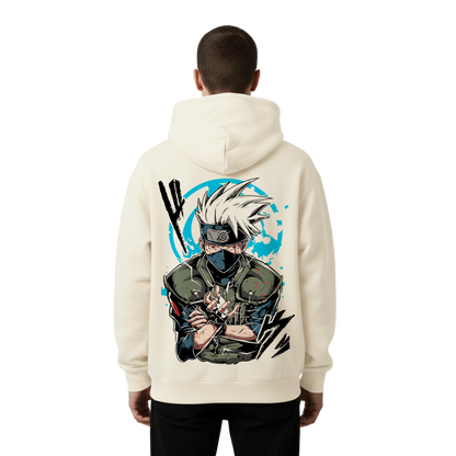 Person wearing a cream Kakashi hoodie with a graphic design on the back against a white background