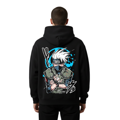 Person wearing a black hoodie with a graphic design of kakashi hatake on the back against a white background